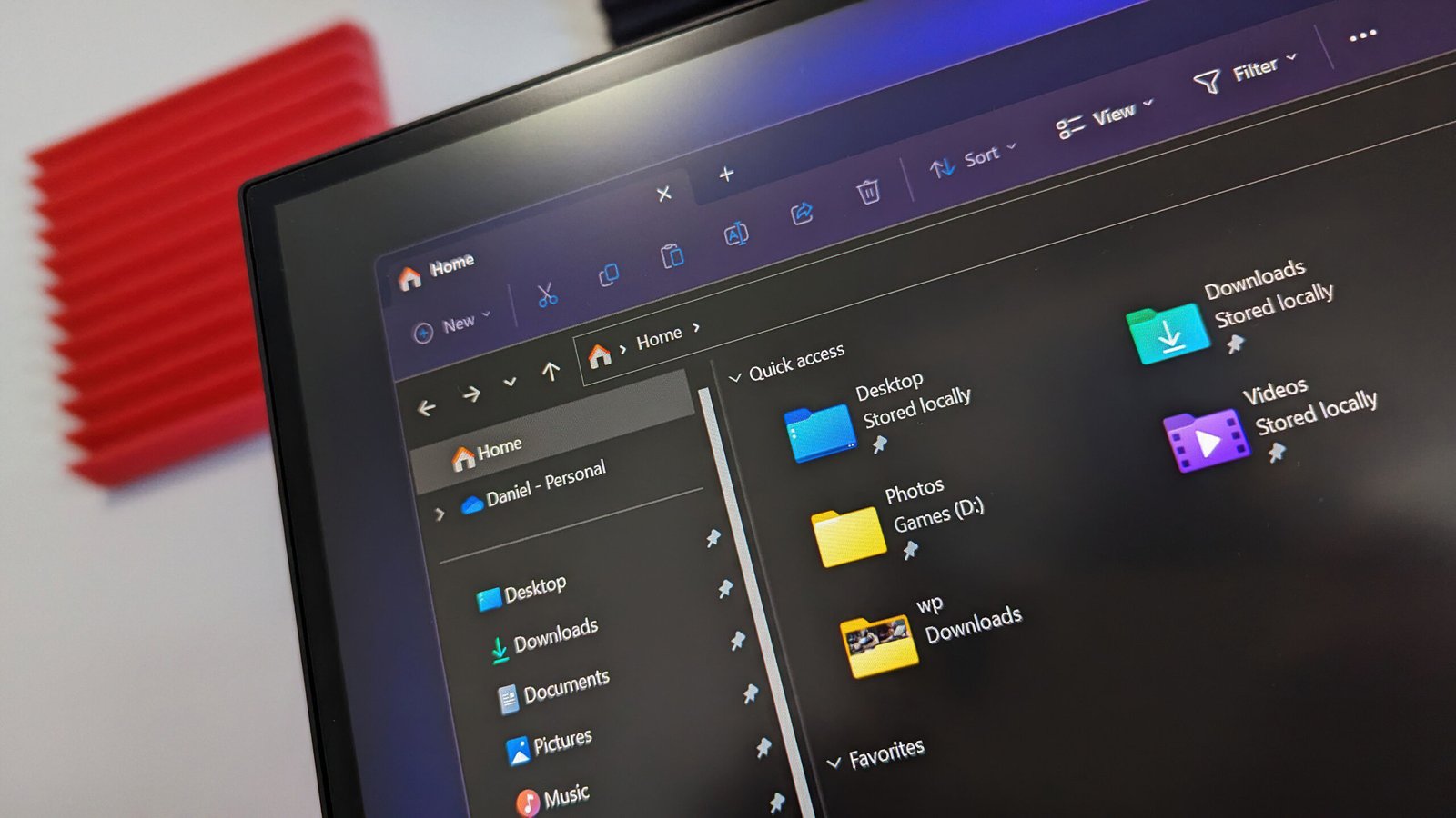 Microsoft is finally updating this decade old File Explorer interface with a new color that better fits dark mode on Windows 11 — let's take a first look